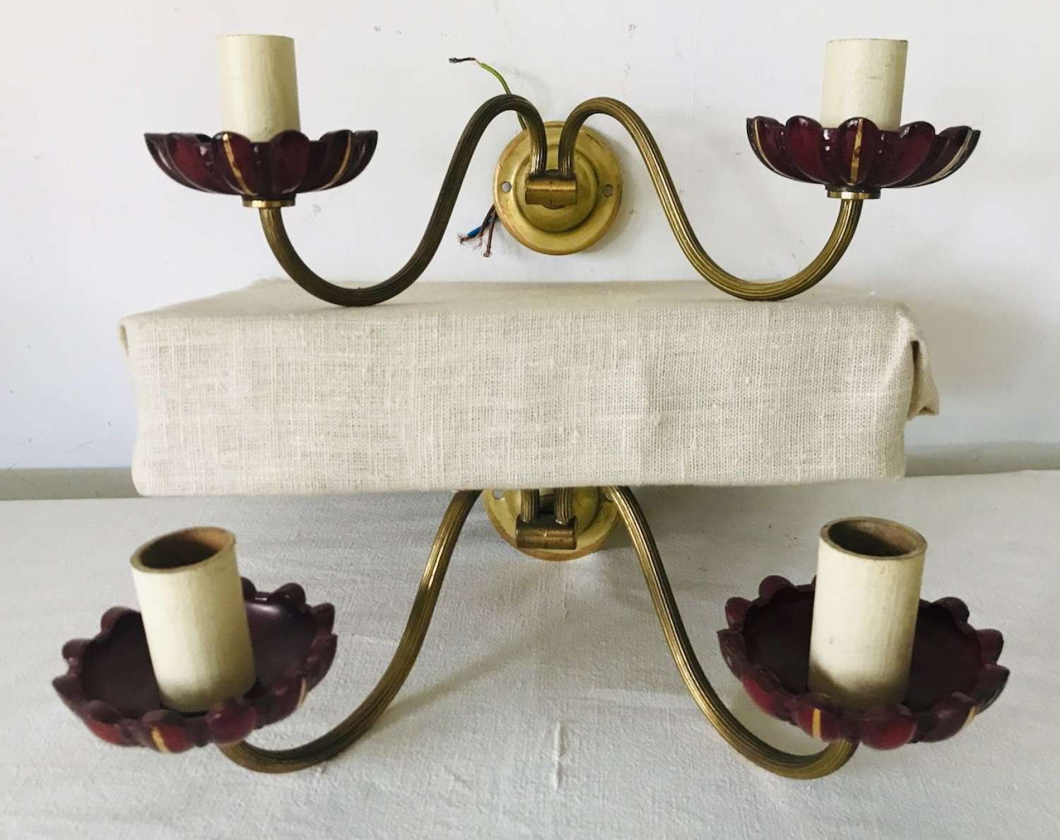 Pair wall brackets with red glass sconces